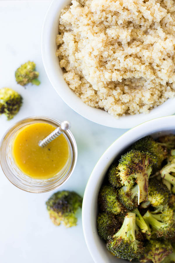 bowls of honey mustard dressing, quinoa, and broccoli