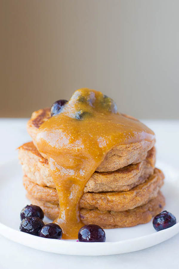 Sweet Potato Pancakes with Peanut Butter Maple Syrup: These gluten free and vegan pancakes are ultra fluffy and tender! Made from healthy, whole food ingredients, these pancakes are the perfect breakfast or brunch! || fooduzzi.com recipe