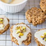 Chewy Lemon Cookies with Coconut Icing and Pistachios: a healthy, gluten free, and vegan cookie that's incredibly chewy and full of fresh flavors! This recipe is refined sugar-free! || fooduzzi.com recipe