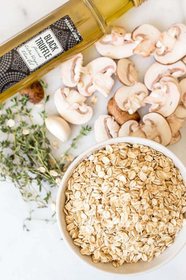 Toasty Truffle Oatmeal: This vegan & gluten free dish is a savory take on your favorite oatmeal breakfast! Packed with flavors like mushrooms, thyme, garlic, and truffle oil, it's a perfect rice-free faux risotto! || fooduzzi.com recipe