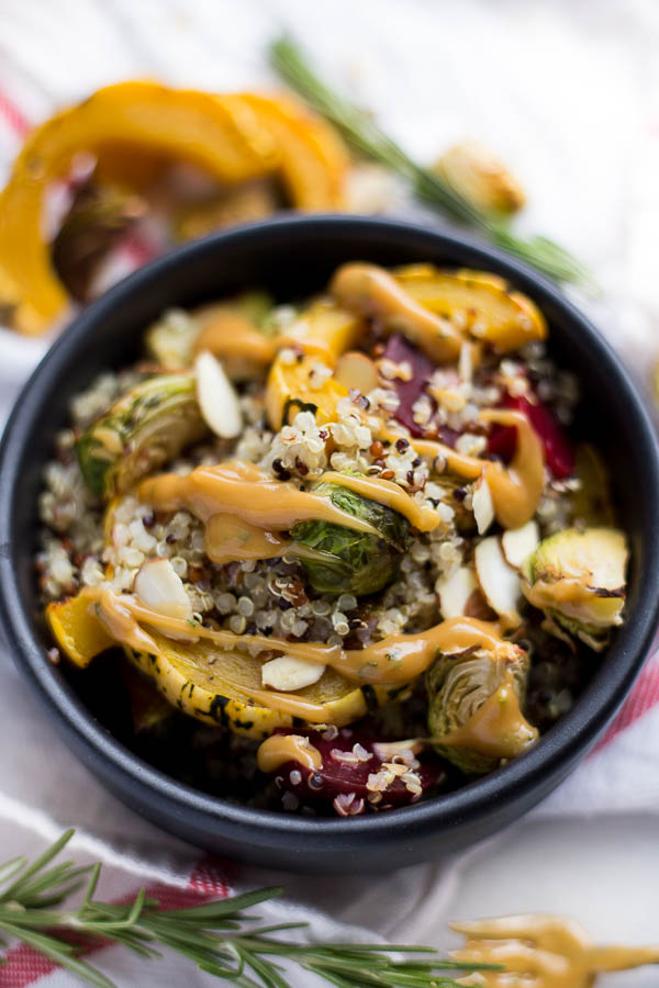 Harvest Quinoa Bowls with Maple Almond Rosemary Sauce: these bowls are vegan, gluten free, and full of fall vegetables! The thick and creamy maple almond rosemary sauce is not to be missed! || fooduzzi.com recipe