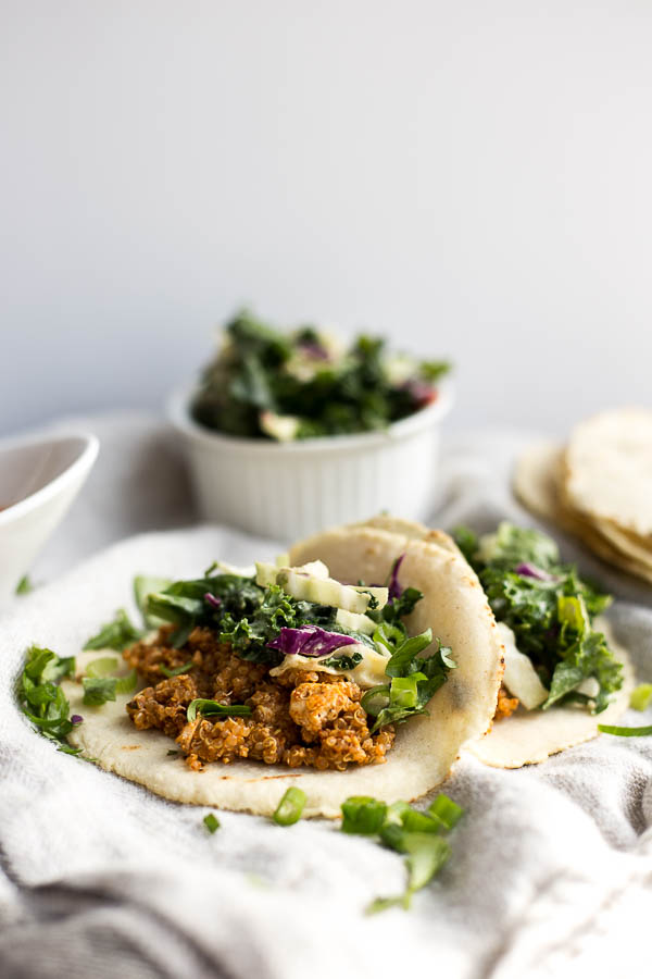 Vegan Tofu Quinoa Tacos with Tahini Kale Slaw: A vegan and gluten free taco recipe that's full of protein, veggies, and flavor! An easy weeknight dinner. || fooduzzi.com recipe