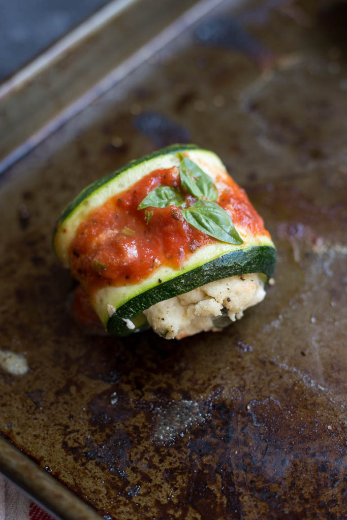 Cheesy Vegan Zucchini Roll Ups: These Cheesy Vegan Zucchini Roll Ups are light and flavorful and perfect for a spring and summer dinner. Naturally vegan and gluten free! || fooduzzi.com recipe