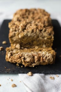 Vegan Pumpkin Coffee Cake: A simple coffee cake with a fall twist! Naturally gluten free and vegan, made with minimal sugar, and topped with an addictive streusel! || fooduzzi.com recipe