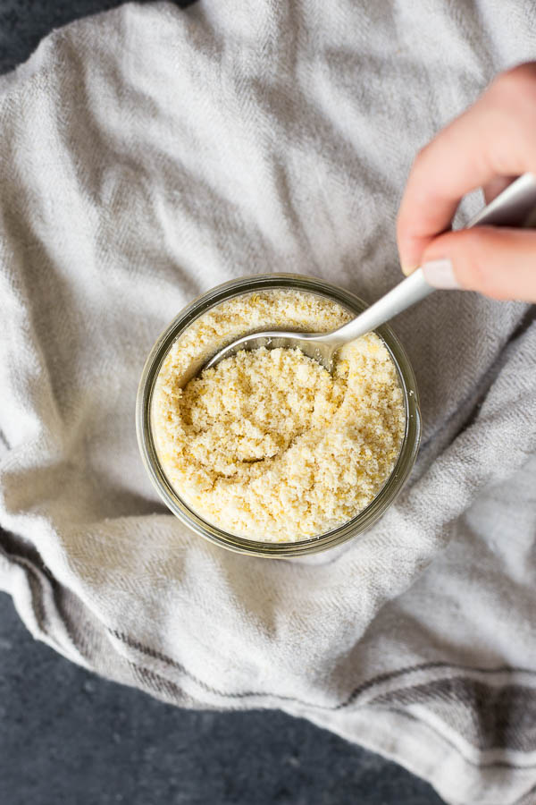 3-Ingredient Vegan Parmesan Cheese: Salty, cheesy vegan parmesan cheese that comes together in minutes! You'll love sprinkling this grated cheese on pasta, pizza, bread, and more. || fooduzzi.com recipe