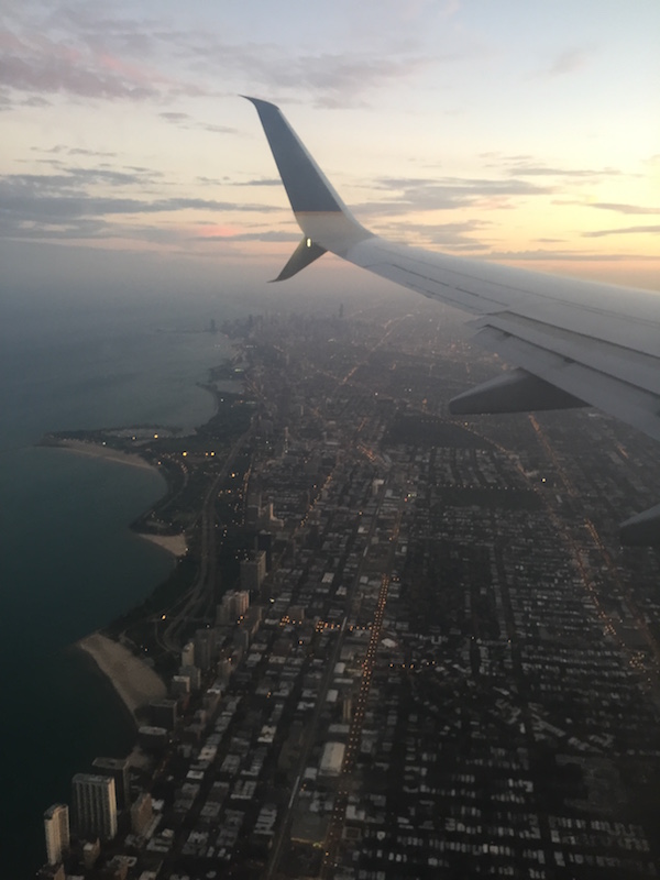 plane wing over chicago