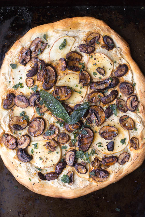 Apple, Sage, & Mushroom Pizza with Vegan Ricotta: A smoky, salty, sweet, and savory pizza perfect for fall! Topped with smoked paprika mushrooms, sweet apple, fried sage, and vegan ricotta! || fooduzzi.com recipe
