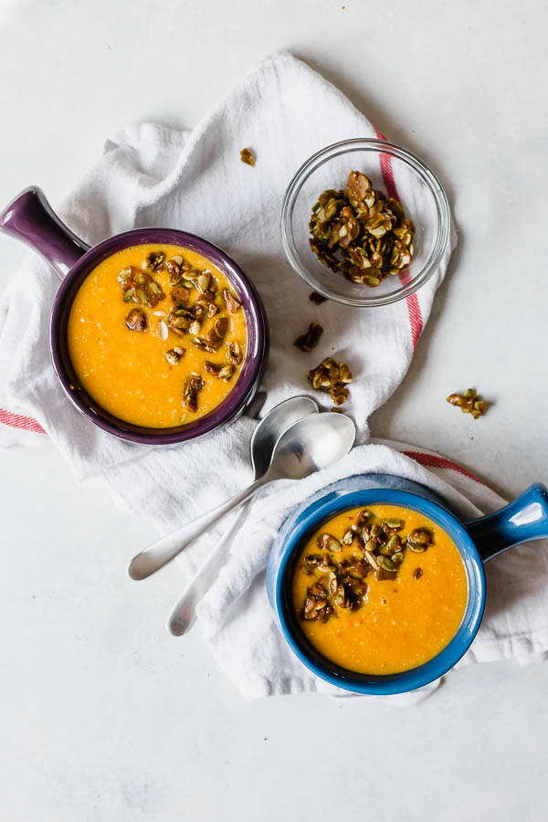 Vegan Butternut Carrot Bisque with Curried Pepita Brittle: A simple, cozy bisque that's creamy, full of flavor, and totally vegan! Don't skip the crunchy and sweet curried pepita brittle! || fooduzzi.com recipe #soup #vegan #easydinner