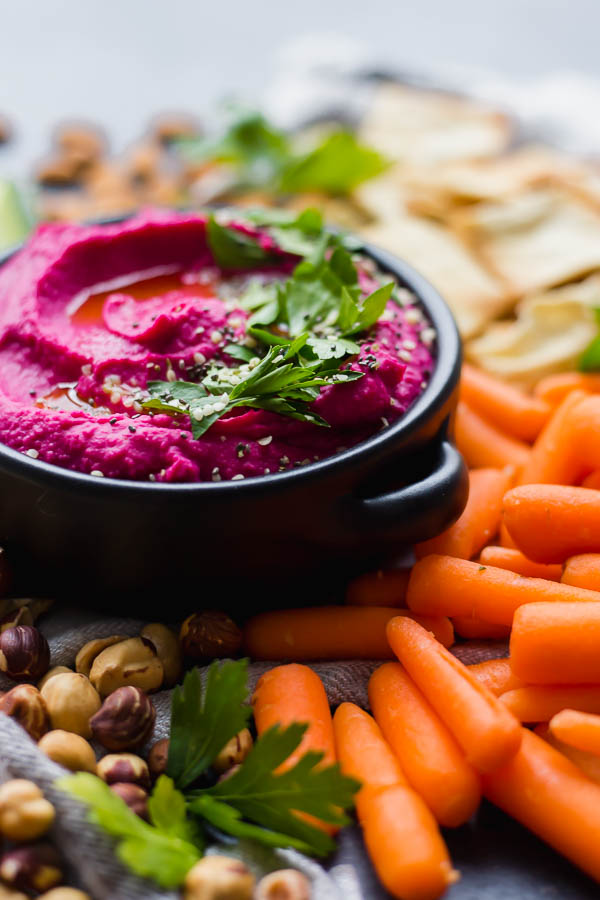 pink dip with carrots and nuts