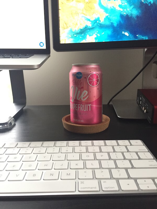 a can of sparkling water on a work desk