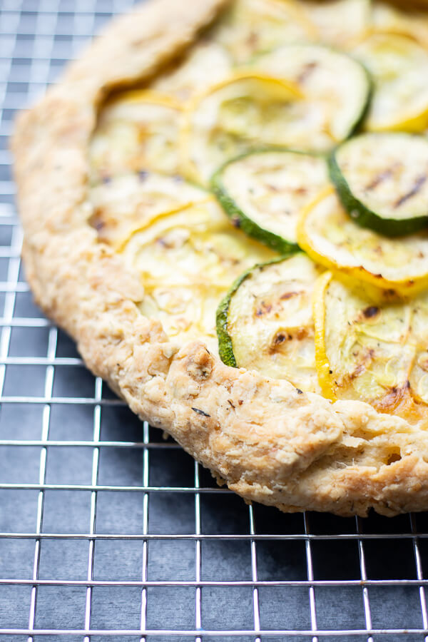 baked vegan grilled zucchini crostata pizza on a cooling rack
