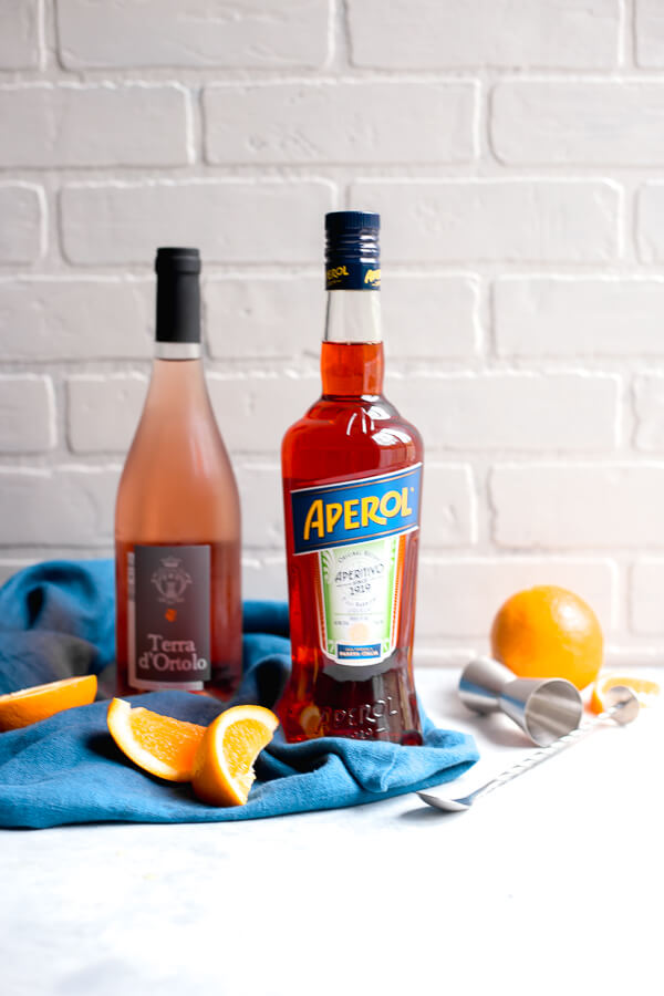 a bottle of aperol and a bottle of rose
