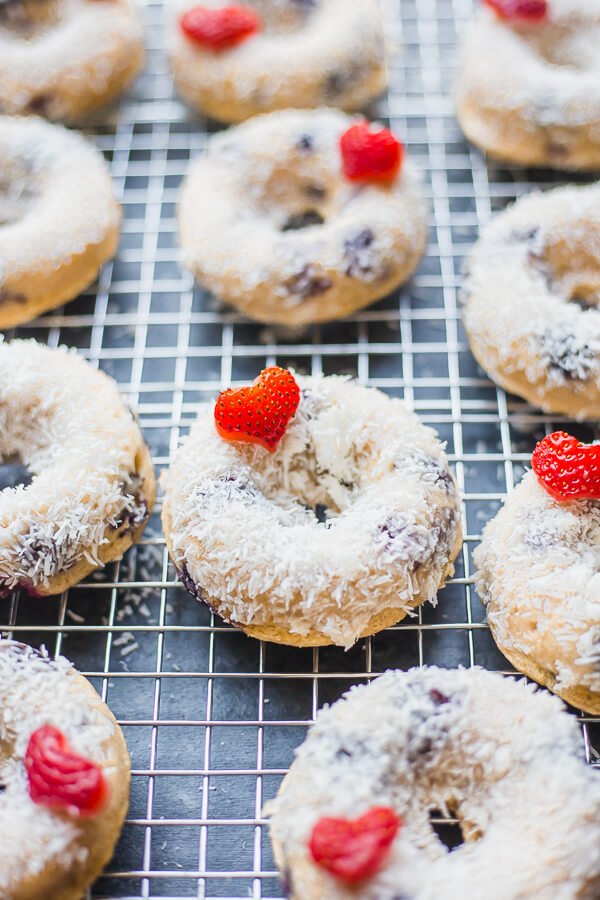 baked vegan blueberry donuts on a cooling rack