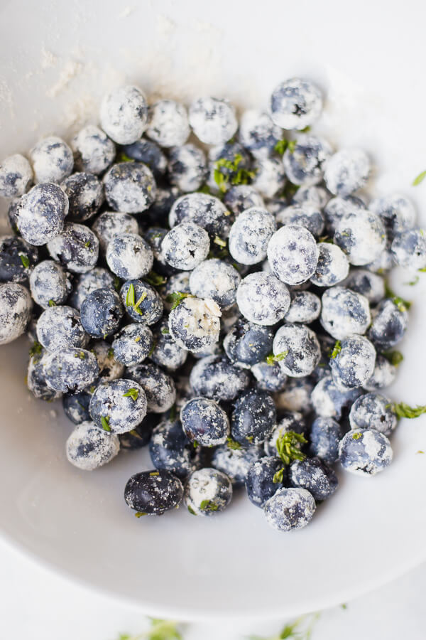 blueberries and thyme covered in flour