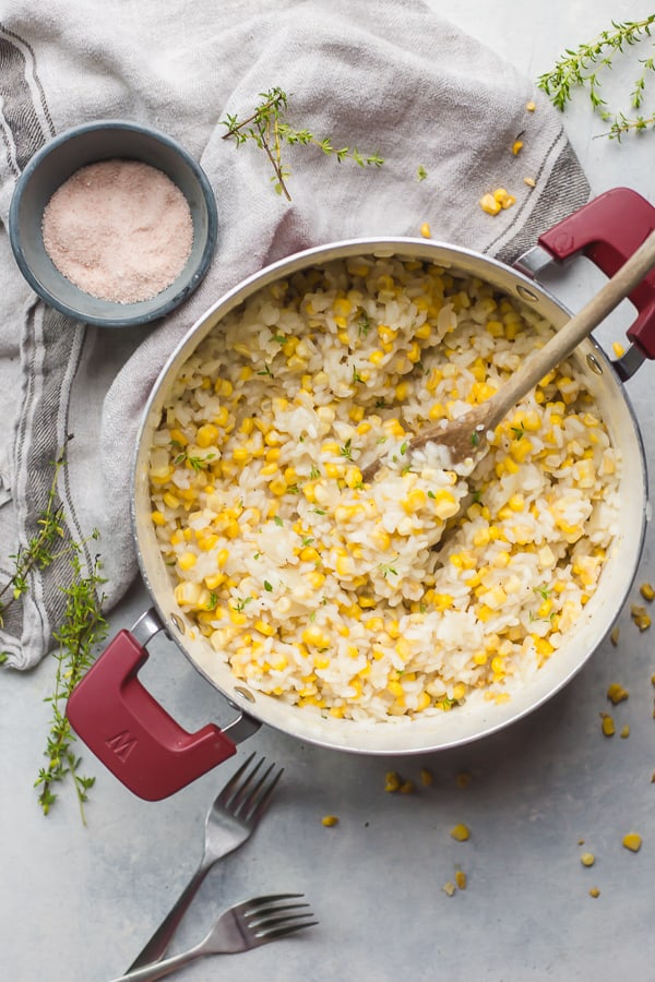 a pot of corn water risotto with thyme and salt