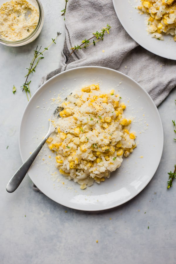 a plate with corn water risotto and a fork