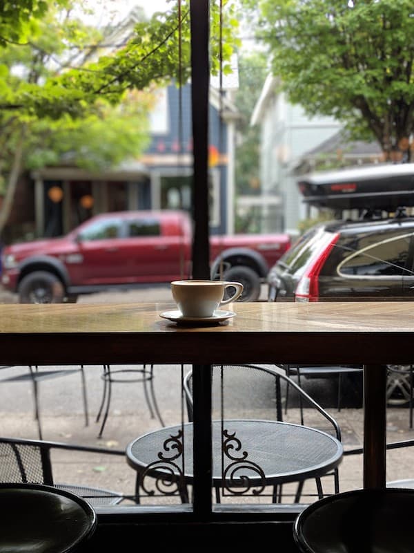 barista coffee in portland, oregon coffee cup by the window