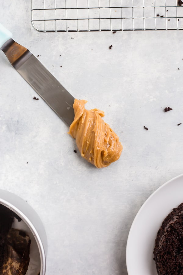 a dollop of peanut butter frosting on a spatula