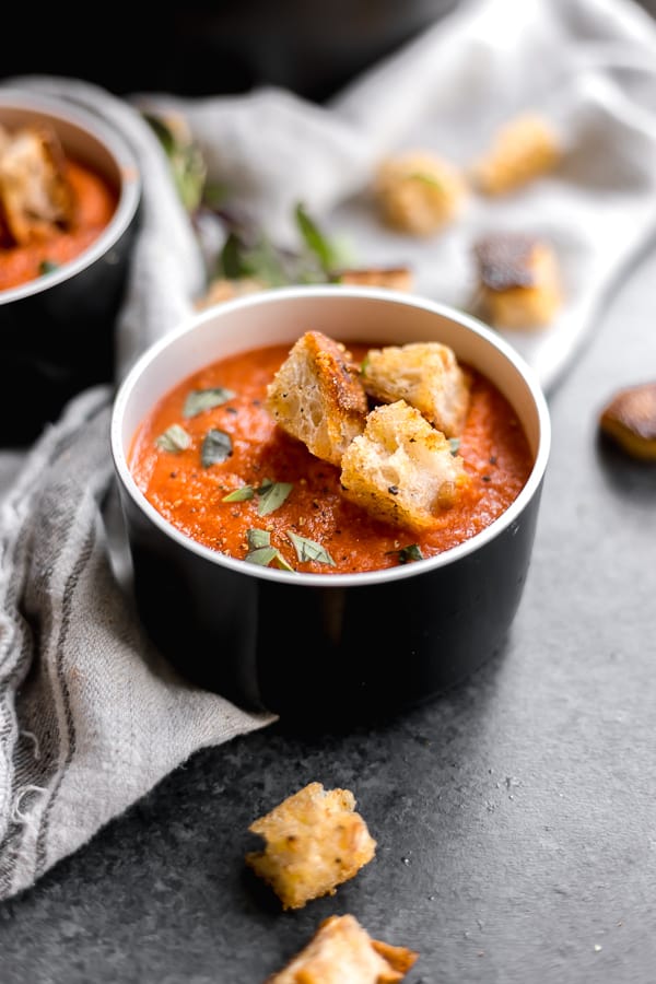 a bowl of san marzano tomato soup with croutons