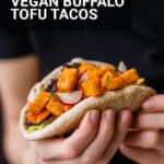 girl holding a vegan buffalo tofu taco