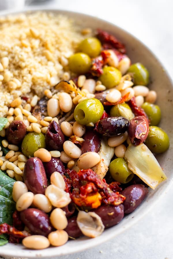 a close-up of the antipasto couscous salad in a bowl