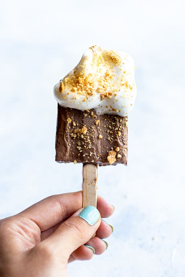 hand holding a vegan s'mores popsicle