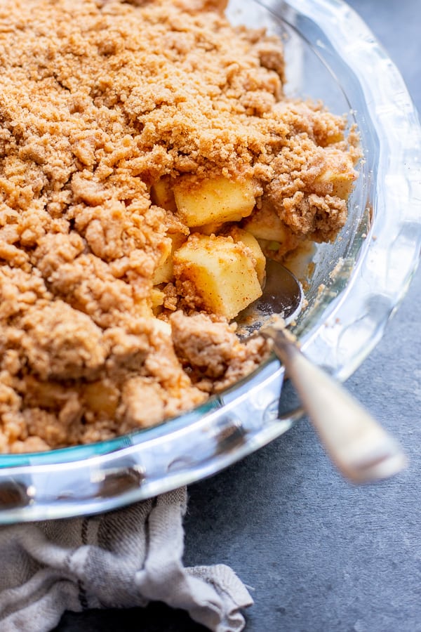 a close-up of a Snickerdoodle Apple Crisp with spoon