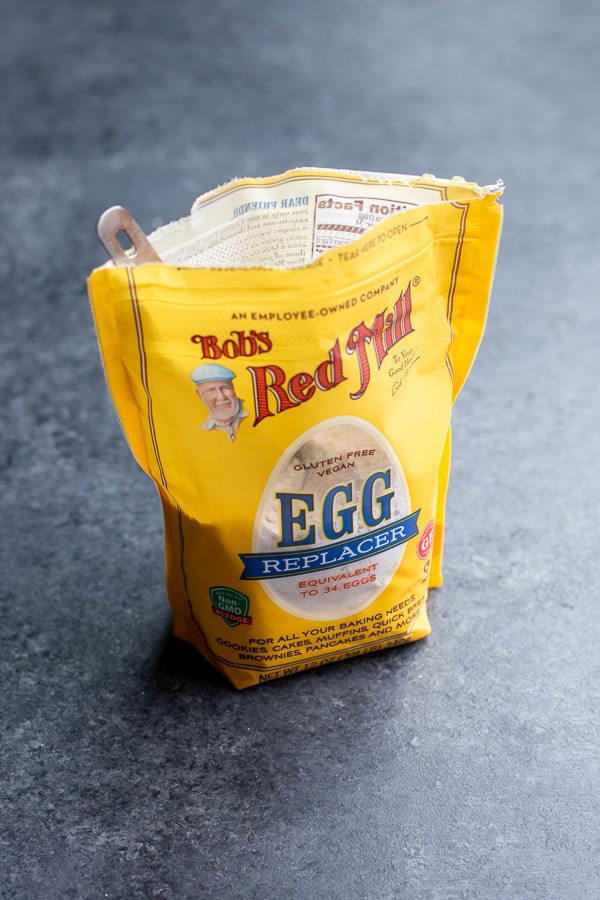 A bag of Bob's Red Mill Gluten Free Vegan Egg Replacer with a measuring spoon