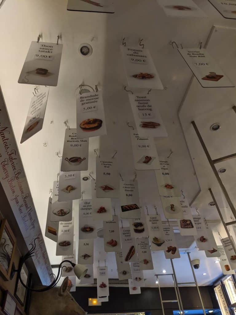 The menu on the ceiling at L'avant Comptoir in Paris, France