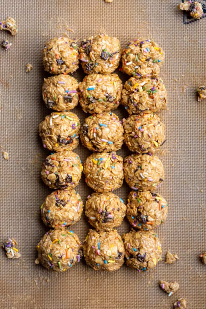 funfetti no-bake cookies lined up on a baking sheet