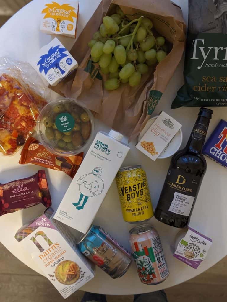 a flat-lay of foods and drinks found at Whole Foods UK