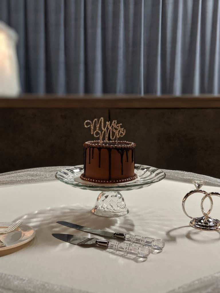simple chocolate wedding cake with chocolate frosting and chocolate drizzle