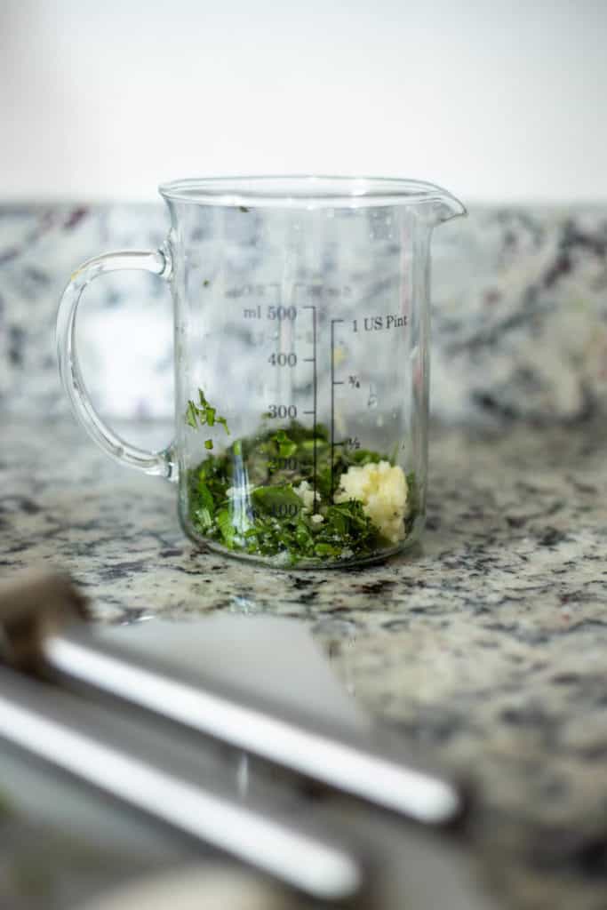 herbs and garlic in a jar