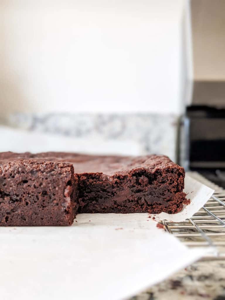 a slice of a pan of brownies