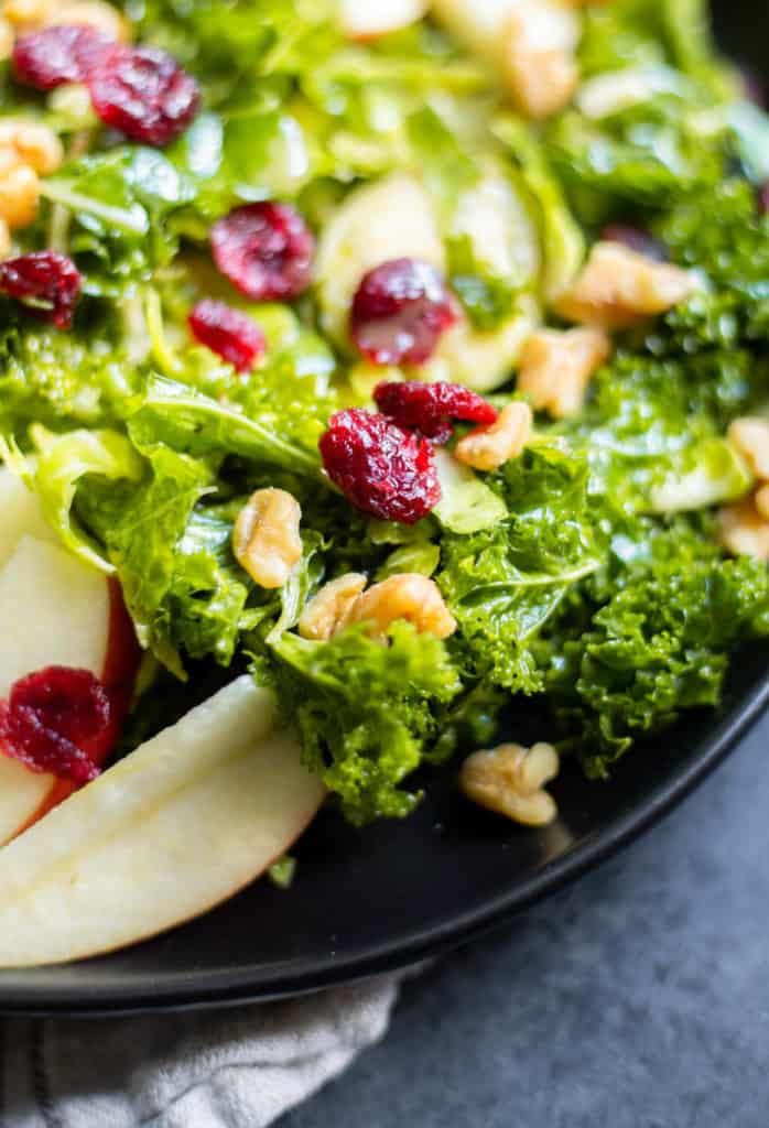A close-up of a Kale Brussels Sprout Salad with Maple Dijon Dressing