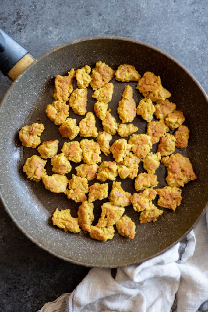 browned seitan nuggets in a pan