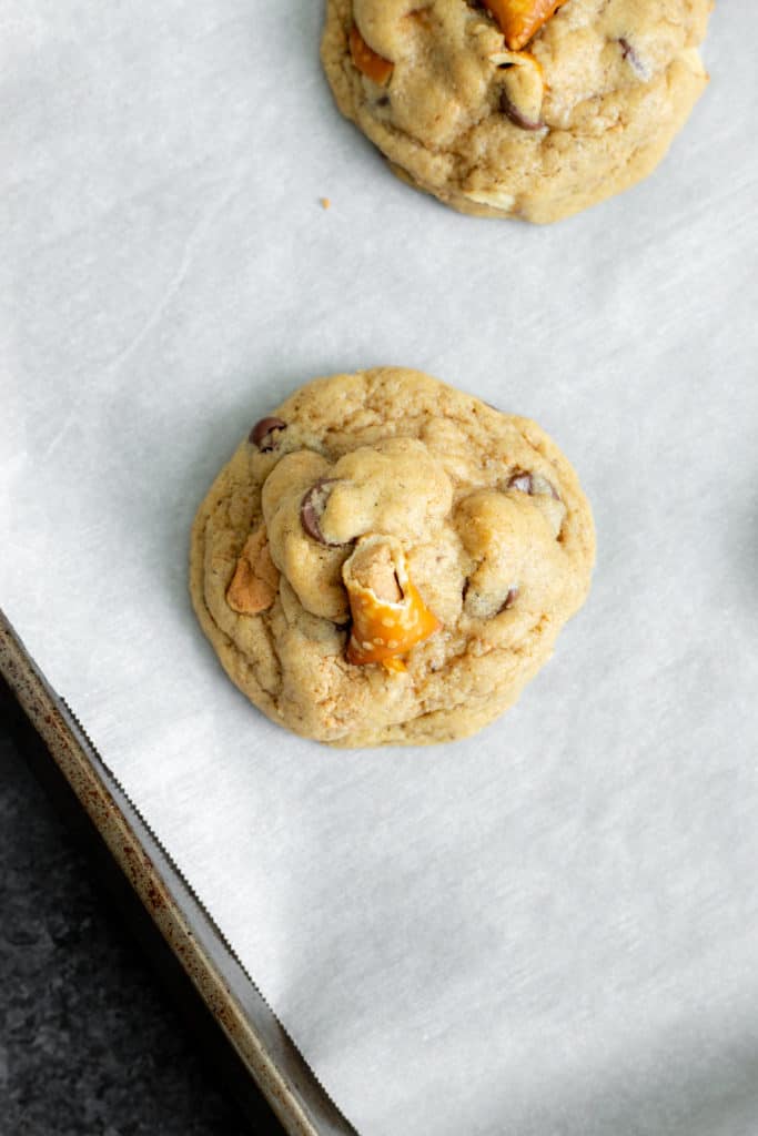 vegan peanut butter pretzel chocolate chip cookies on a baking sheet