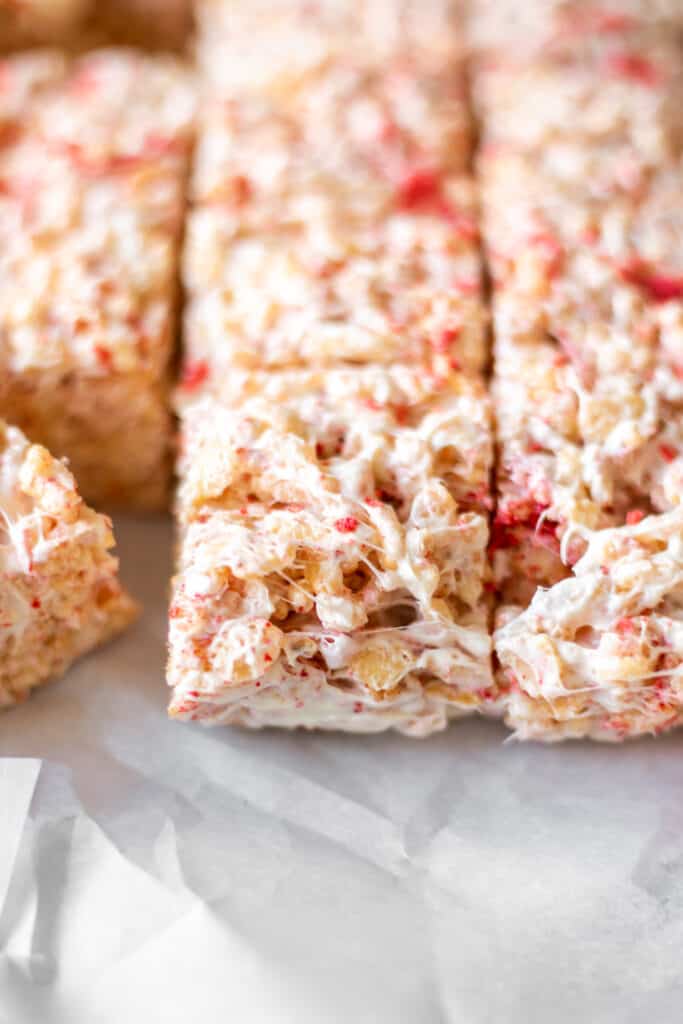 a close-up of a strawberries and cream crispy rice treat
