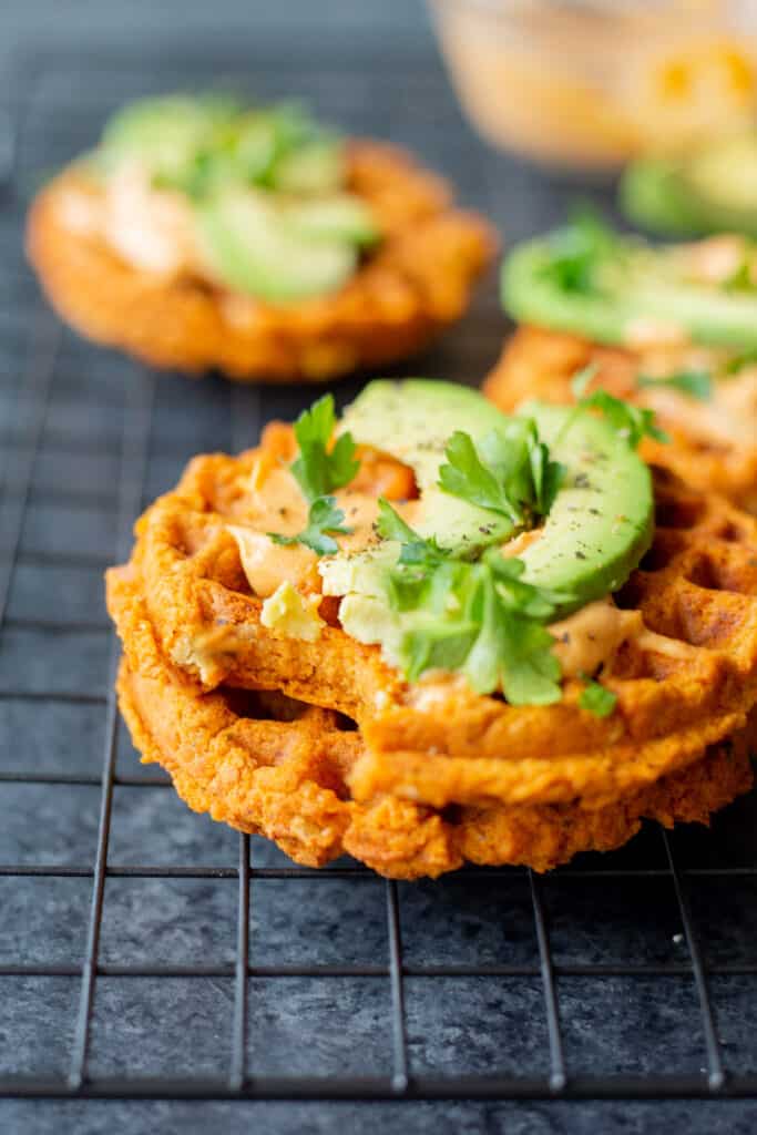 a stack of buffalo falafel waffles on a cooling rack