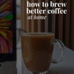 a mug of coffee next to a computer and the title of this article 'how to brew better coffee at home'