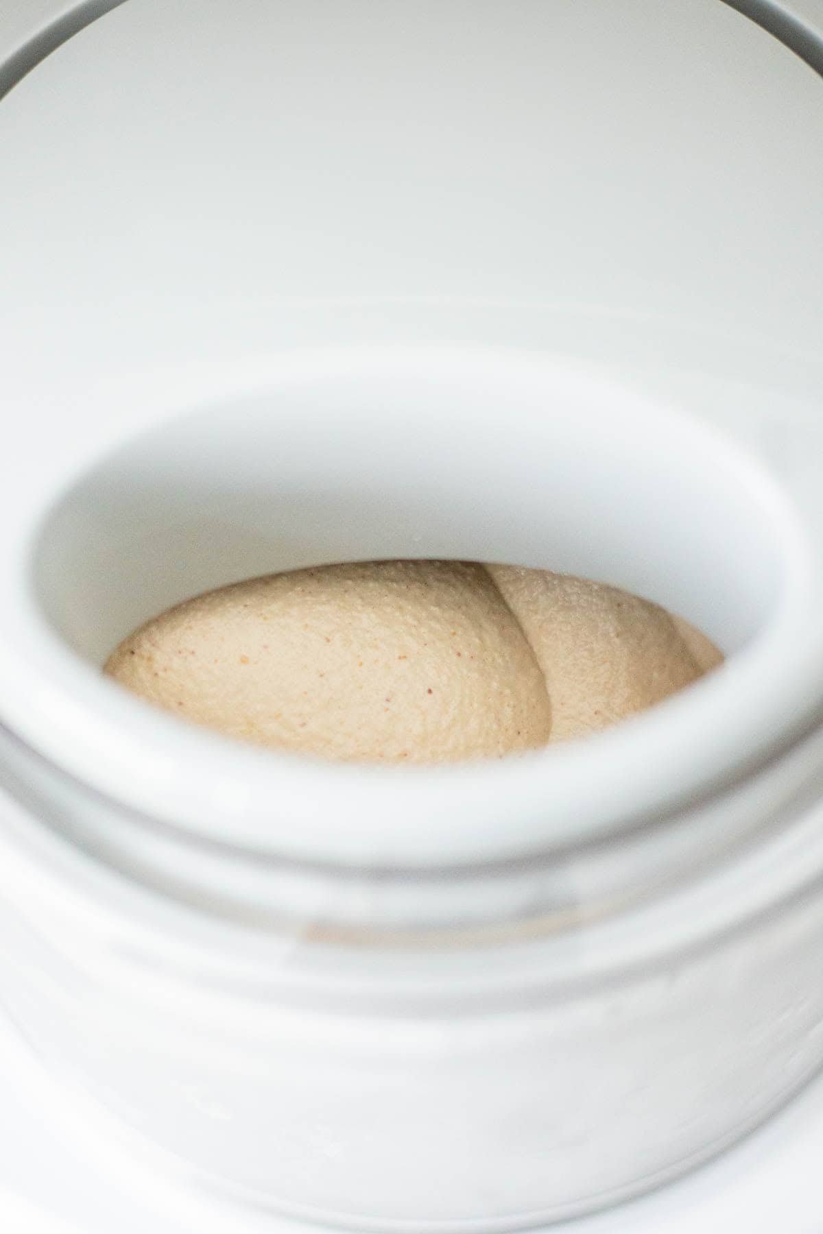 Tan ice cream churning in an ice cream maker
